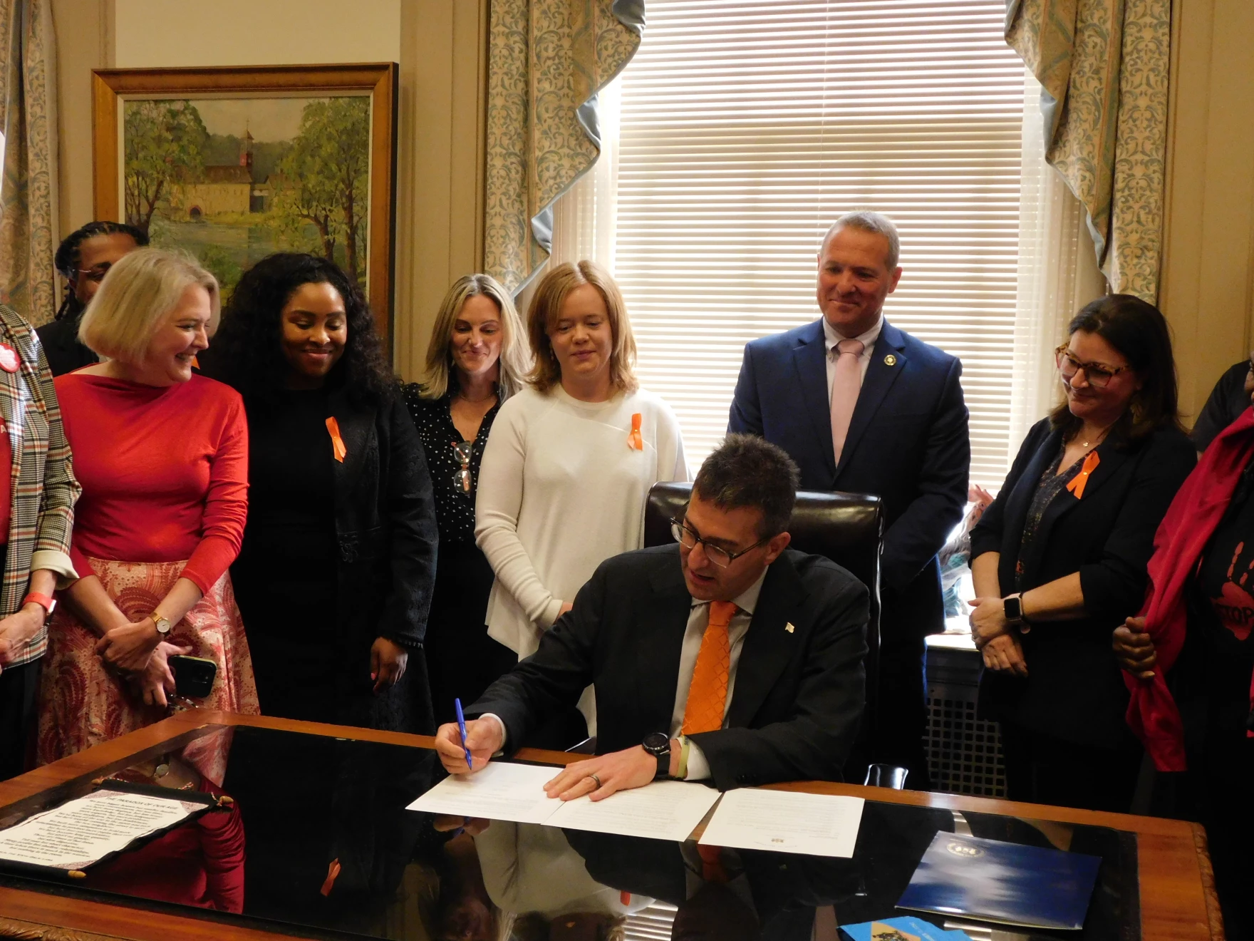 Gov Matt Meyer signs an executive order